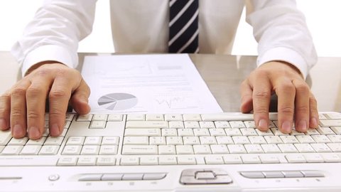 Preparing financial statements / HD stock footage of business person working with computer keyboard

