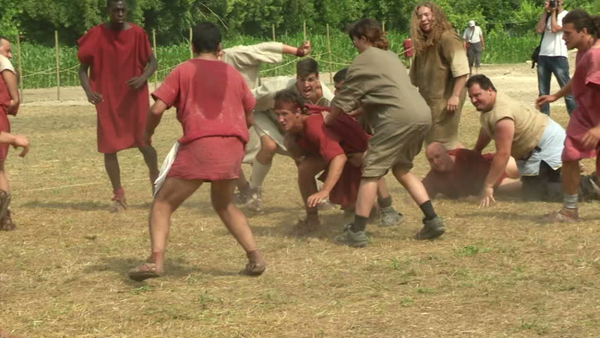 AQUILEIA - JUNE 22: Roman legionary play Harpastum (a form of ball game played