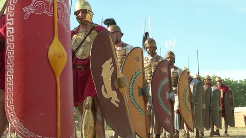AQUILEIA - JUNE 22: Roman legionaries marching during the reenactment “Tempora Aquileia” on June 22, 2013 in Aquileia, Italy