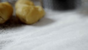 Close up of a hand pressing potatoes for a preparation of gnocchi. High definition video.