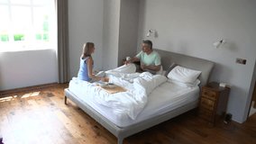 Morning routine time lapse sequence of middle aged couple waking up and eating breakfast - Powered by Shutterstock - Get 15% off with code: PIKWIZARD15