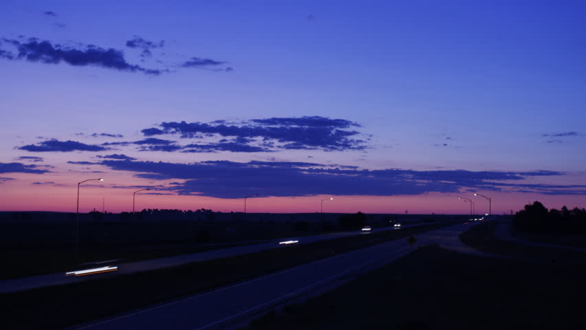 Timelapse video of Pink Sunrise over Busy Highway