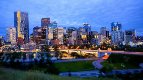 Night shot of downtown Calgary, time lapse, business names are blurred out