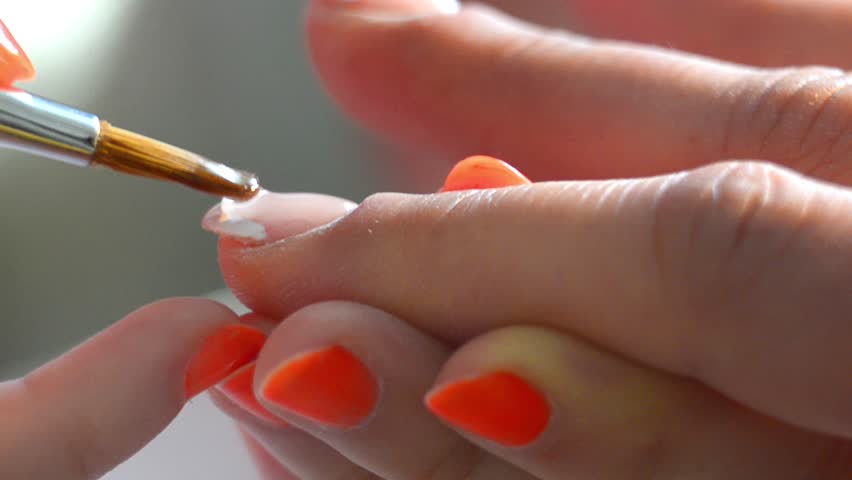 Nail polish - Stock Video. Nail polish on manicure is painted on her