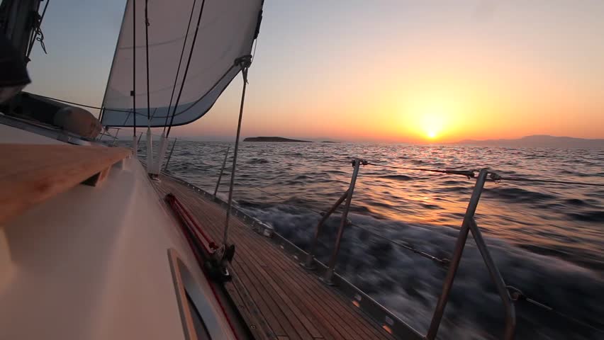Yacht sailing against sunset. Travel Concept. Sailboat. Luxury yacht. Sailing.