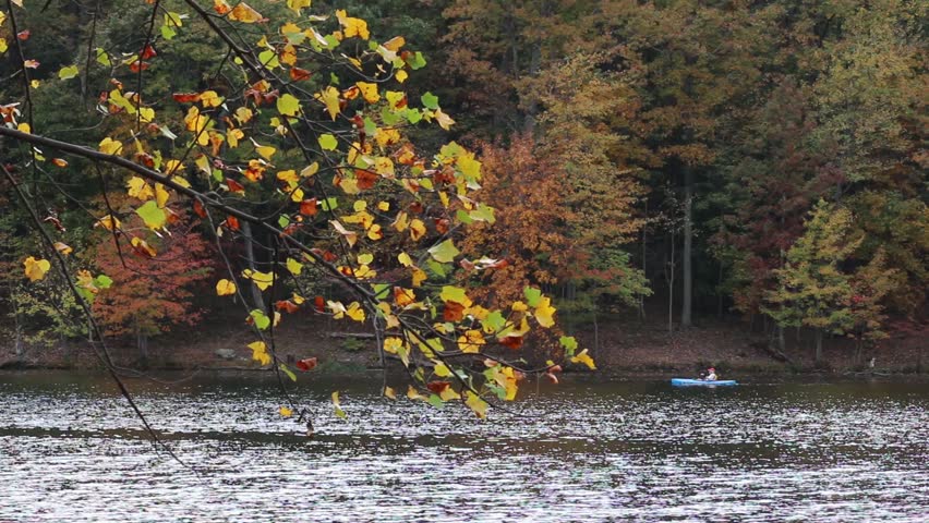 Kayak with fall foliage in foreground
