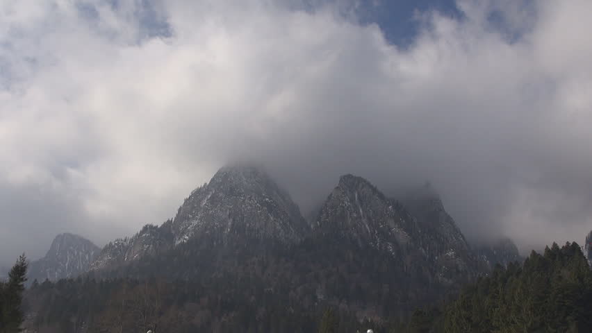 Dramatic storm clouds over mountain peak 