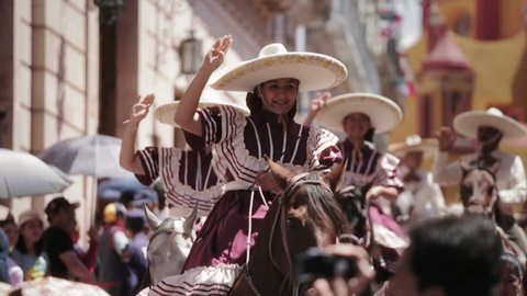 GUANAJUATO, MEXICO - 28 SEPTEMBER 2013: Women in a Traditional Escaramuza Charra, the feminine practice in mexican rodeos during parade DESFILE DE GUANAJUATO 2013