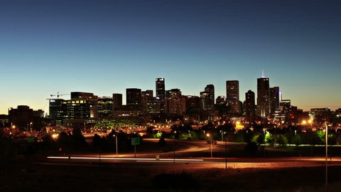 Downtown Denver, Colorado at Sunrise, with Interstate highway in the foreground. Ultra HD 4K long exposure time lapse.