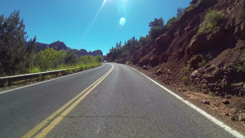 Driver's perspective of driving on route 89 into Sedona, Arizona.