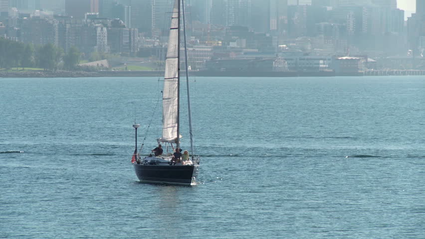 Mature couple sailing on a yacht on the Puget Sound in Seattle, Washington. 