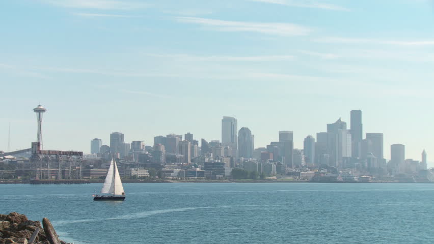 Yacht sailing on the Puget Sound in Seattle, Washington with Seattle city
