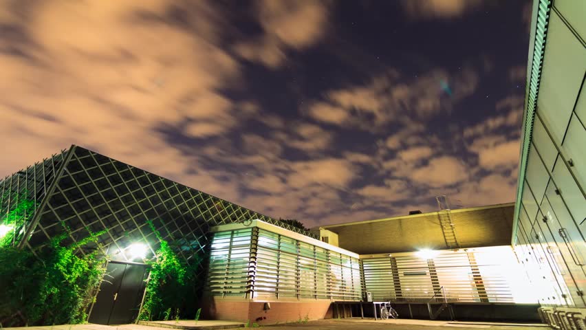 Beautiful Full HD 30fps timelapse of the night sky over an office building in Amsterdam in the  Netherlands