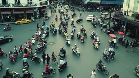 HANOI - SEPTEMBER 17: Timelapse view of crazy traffic in Hanoi Hoan Kiem district (old quarter) on September 17 2013 in Hanoi, Vietnam. No Identifiable person can be seen in the scene.