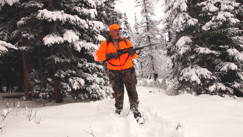 Hunter stalking Elk in the deep snow in northern Colorado.