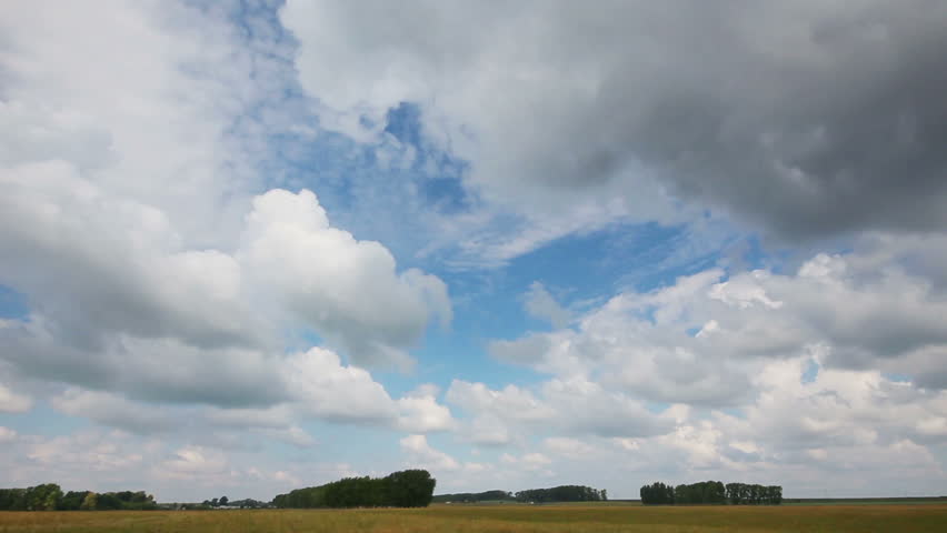 timelapse with clouds moving over field