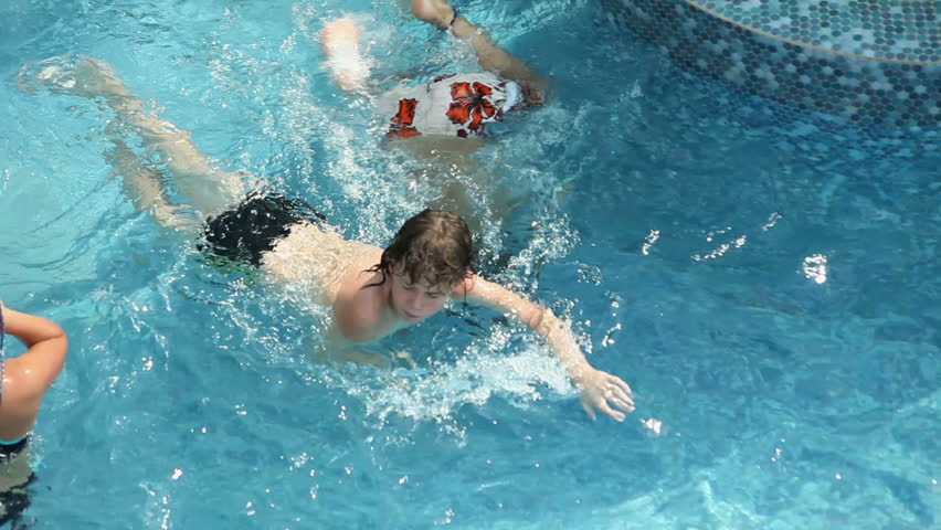 Kids enjoying refreshing in pool | Shutterstock HD Video #4909355
