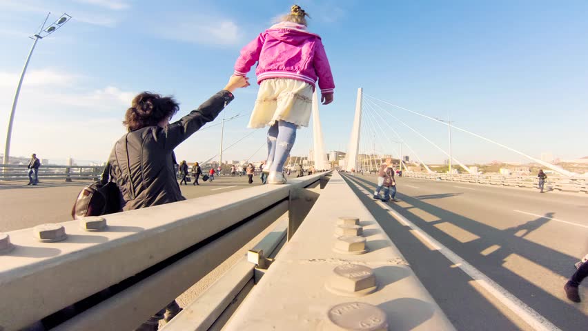 VLADIVOSTOK-October 20: Timelapse. People walking over the Golden Bridge on