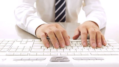 Close up of a man using computer / HD stock footage of person's hands typing on computer keyboard

