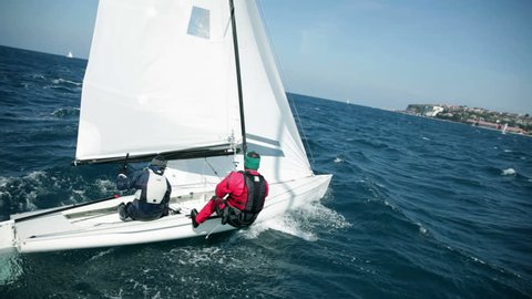 Sailboats racing to the finish line on sea
