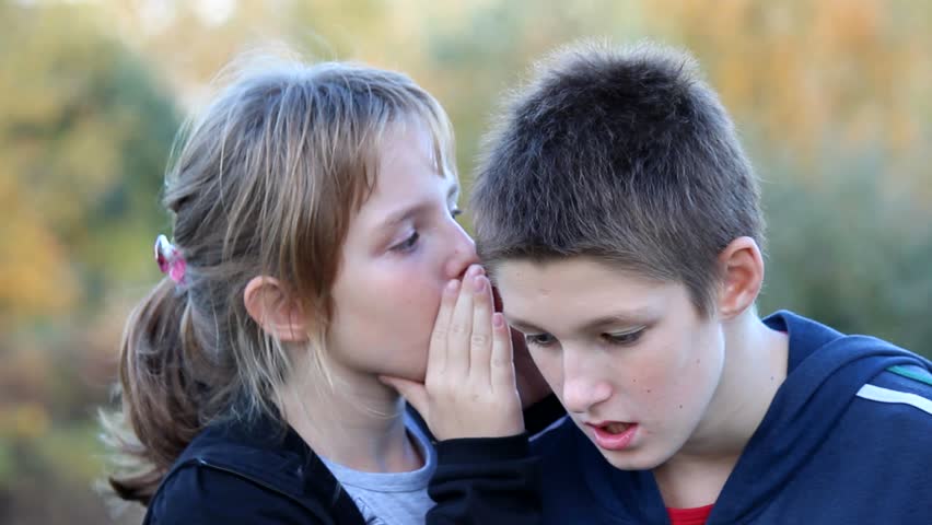 Girl whispers boy in the ear secret | Shutterstock HD Video #4913045