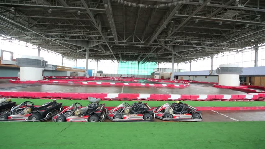 Many karts parked at start of the tour, moving camera