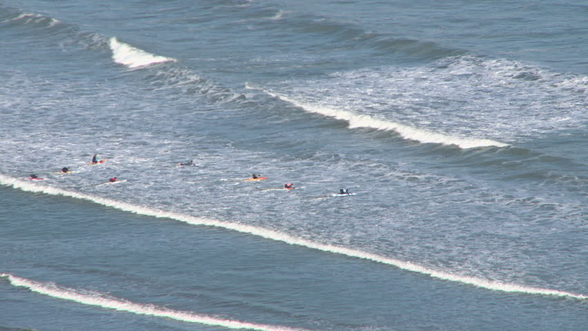 Group of paddlers going through waves