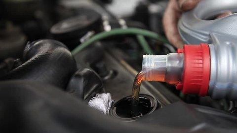 Close up of pouring motor oil.../Engine lubrication