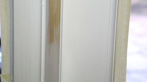painting doorframes at the new home, close up