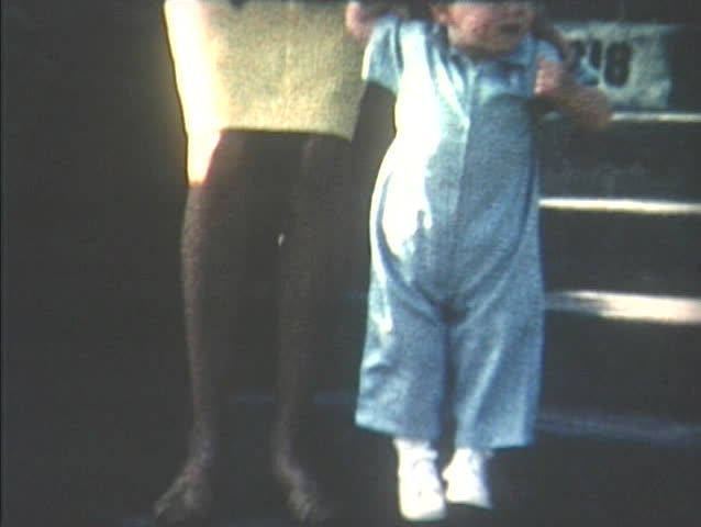 1960s home video of toddler boy learning to walk, Seattle, Washington. 