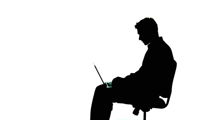 Man working on a laptop, silhouetted against a white background.
