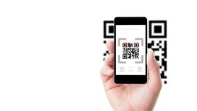 Smartphone in hand scanning QR code - Powered by Shutterstock - Get 15% off with code: PIKWIZARD15
