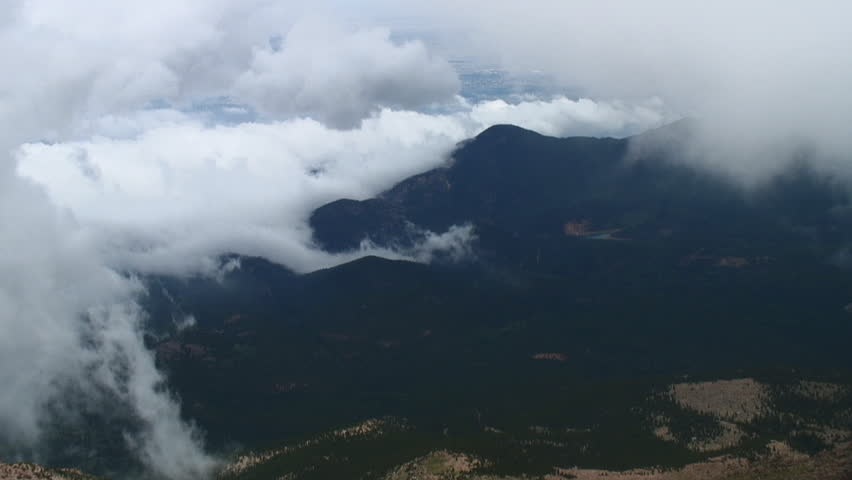 Heavy bank of clouds snakes down from the summit of Pikes Peak toward Colorado Springs (time lapse)