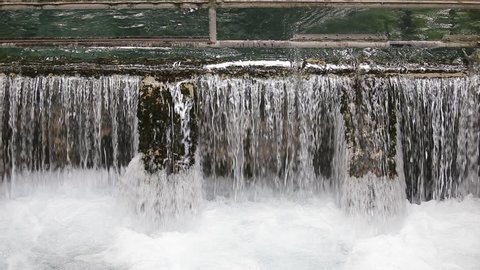 Close up shot of water flow from reservoir