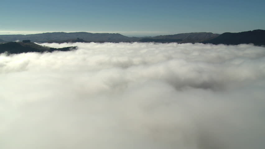Fog time lapse. Fog disperses to reveal a river valley.