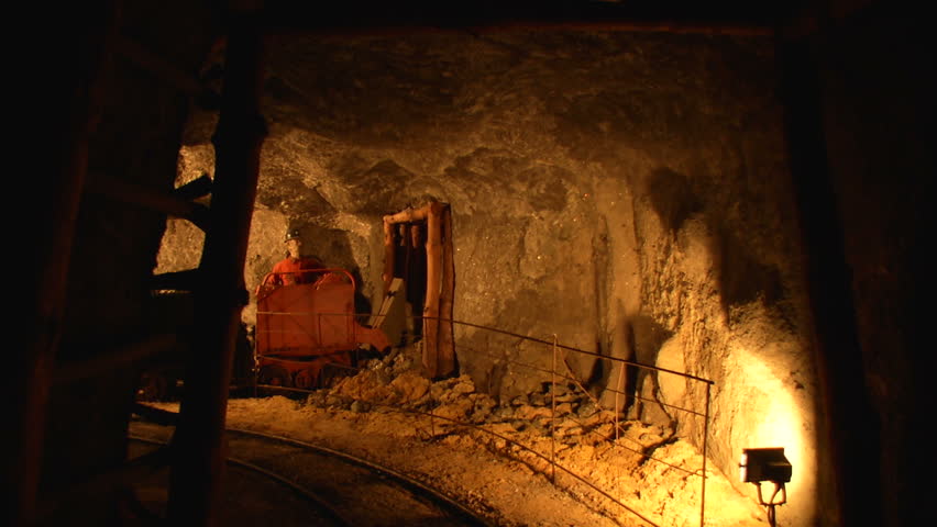 Mine tunnel with rails and light