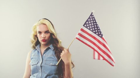 Patriotic woman holding american flag cinemagraph seamless loop Adlı Stok Video