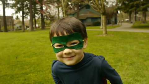 Superhero Boy Runs Toward Camera