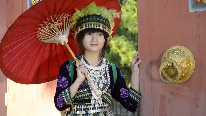 cute asian young girl in beautiful hill tribe (HMONG) costume of northern