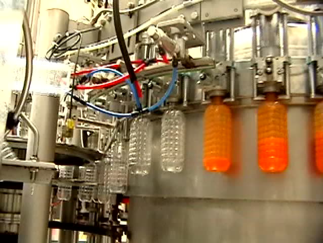 A wide shot time lapse of an entire robotics assembly plant in motion 