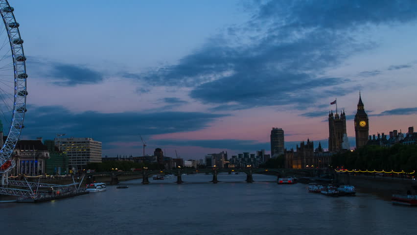 London Eye on Thames river from day to dusk time-lapse