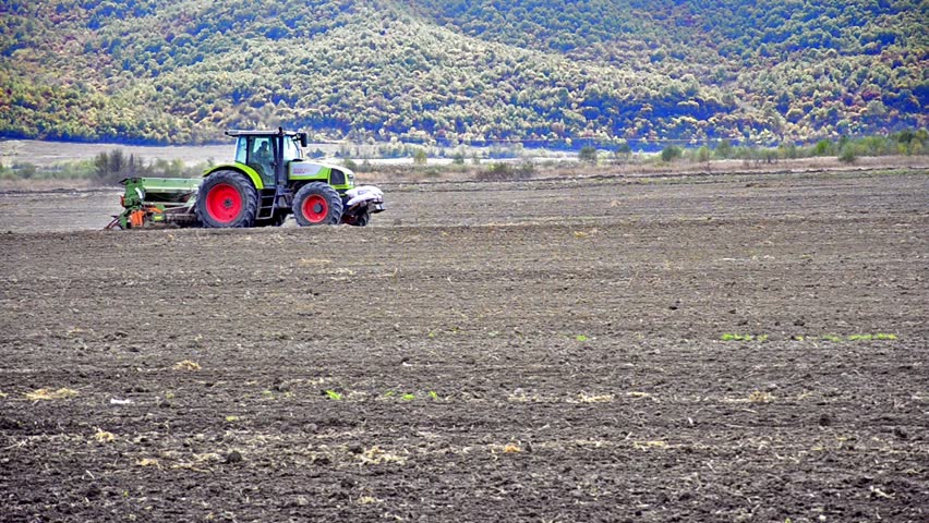 Tractors preparing land for sowing