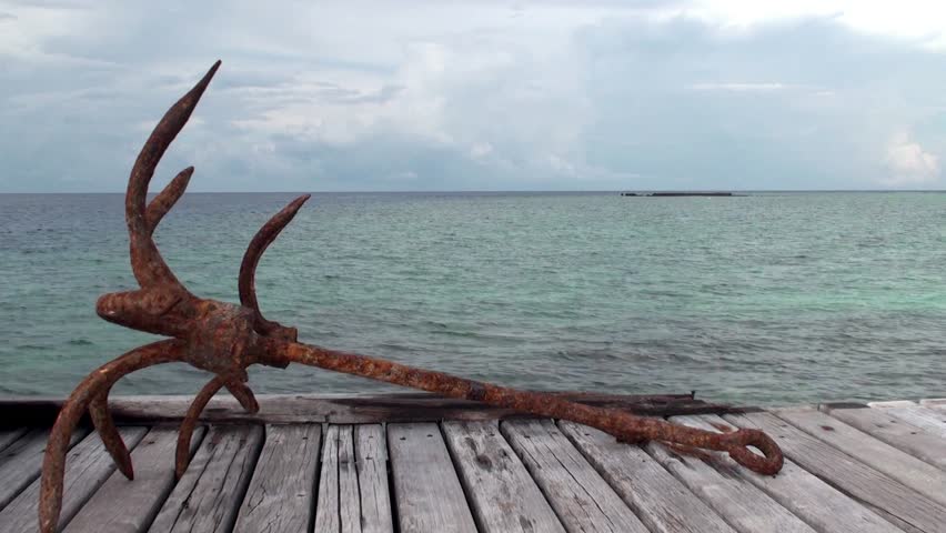 Sea view with the old anchor in the foreground. Maldives.