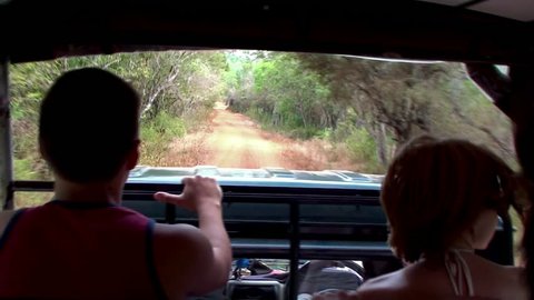 Tourists in an open jeep at the safari. Yala NP, Sri Lanka.