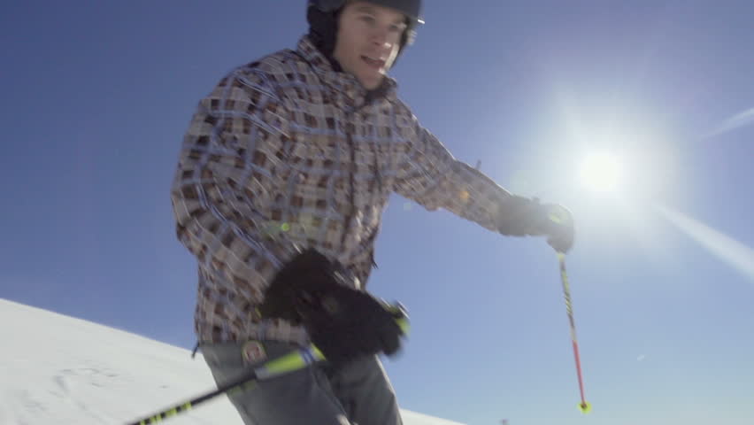 Beautiful Slow Motion Of Skier Skiing Down The Snowy Slope With Spectacular