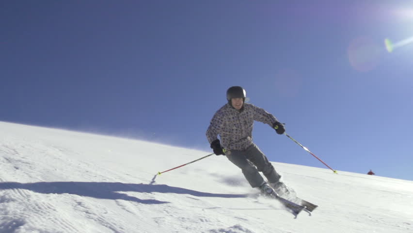 Slow Motion Of Skier Skiing Down The Snowy Slope On A Sunny Winter Day. 