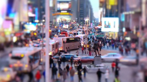 Zooming busy city traffic time lapse of Times Square, tilt shift and circular blur.