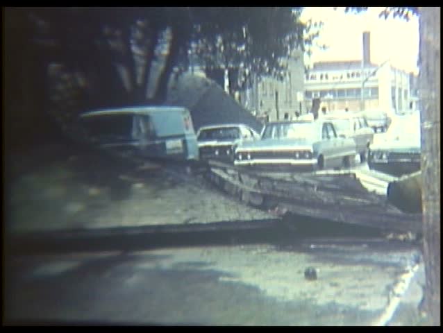 1970s - Home movie style footage of flooding in Harrisburg Pennsylvania in 1972.