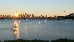 Time lapse clip of sailboats sailing on Lake Union on a beautiful sunny day with Seattle cityscape in the background.