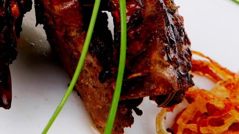 grilled ribs served over big white plate 1920x1080 intro motion slow hidef hd